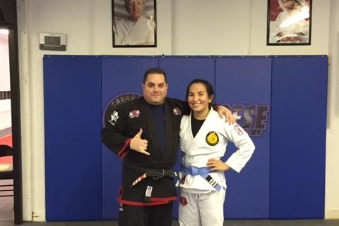 Medical student Caitlin McManus earns jiu-jitsu promotion